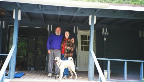 My parents in front of their home in the California Siskiyou mountains, with their dog Daisy.